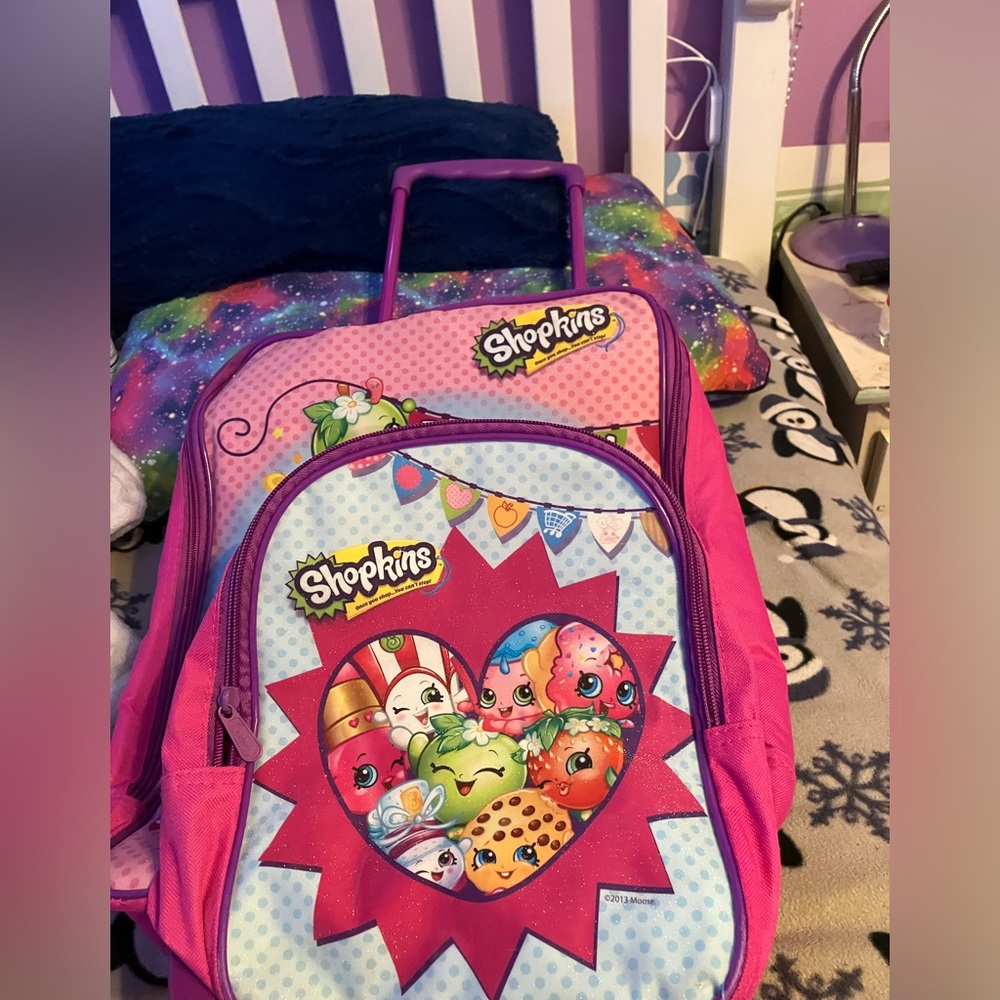 Shopkins suitcase and backpack. Has a retractable handle and lots of space.